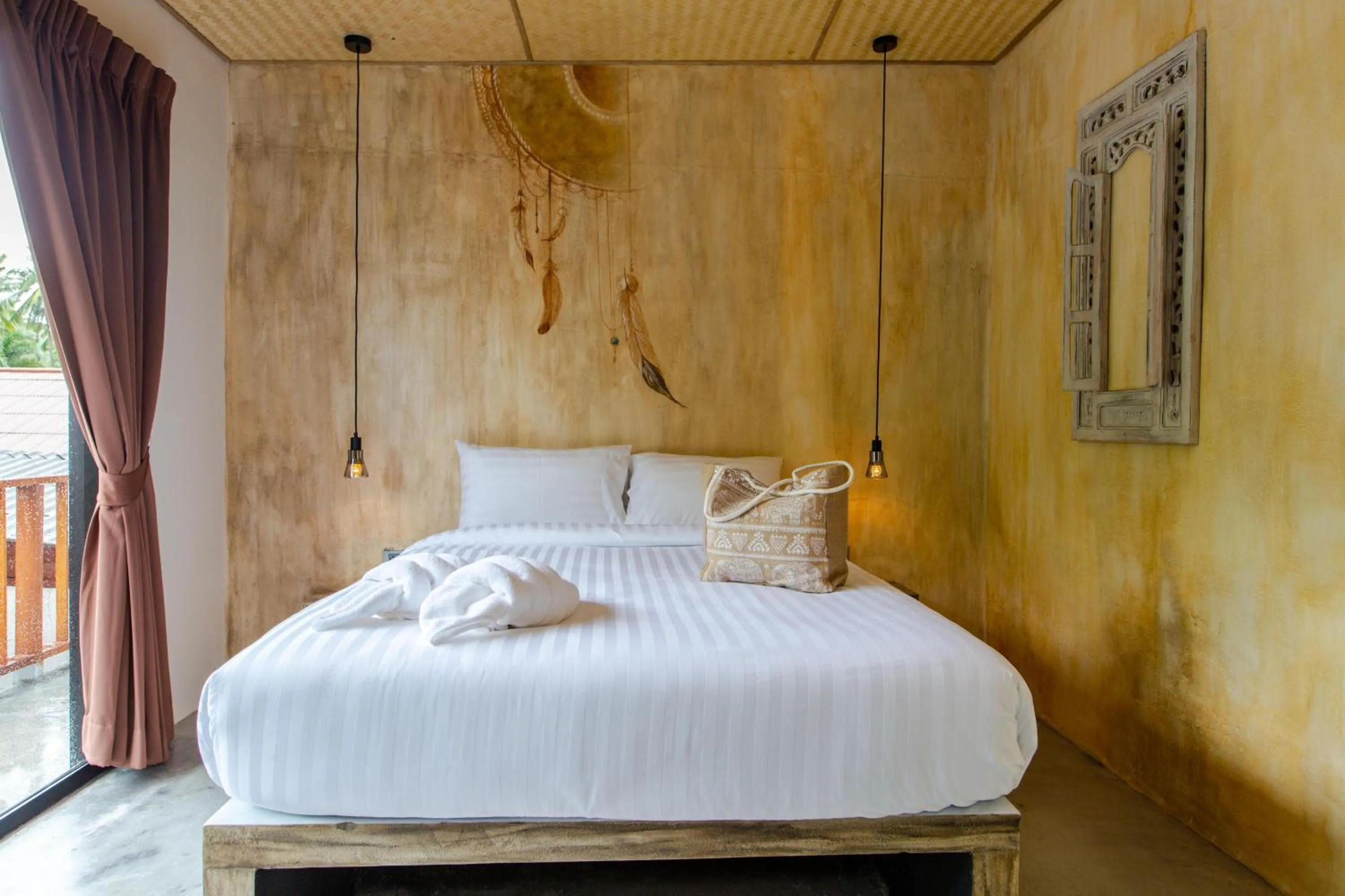 Bed in Dreamcatcher Boutique Hotel