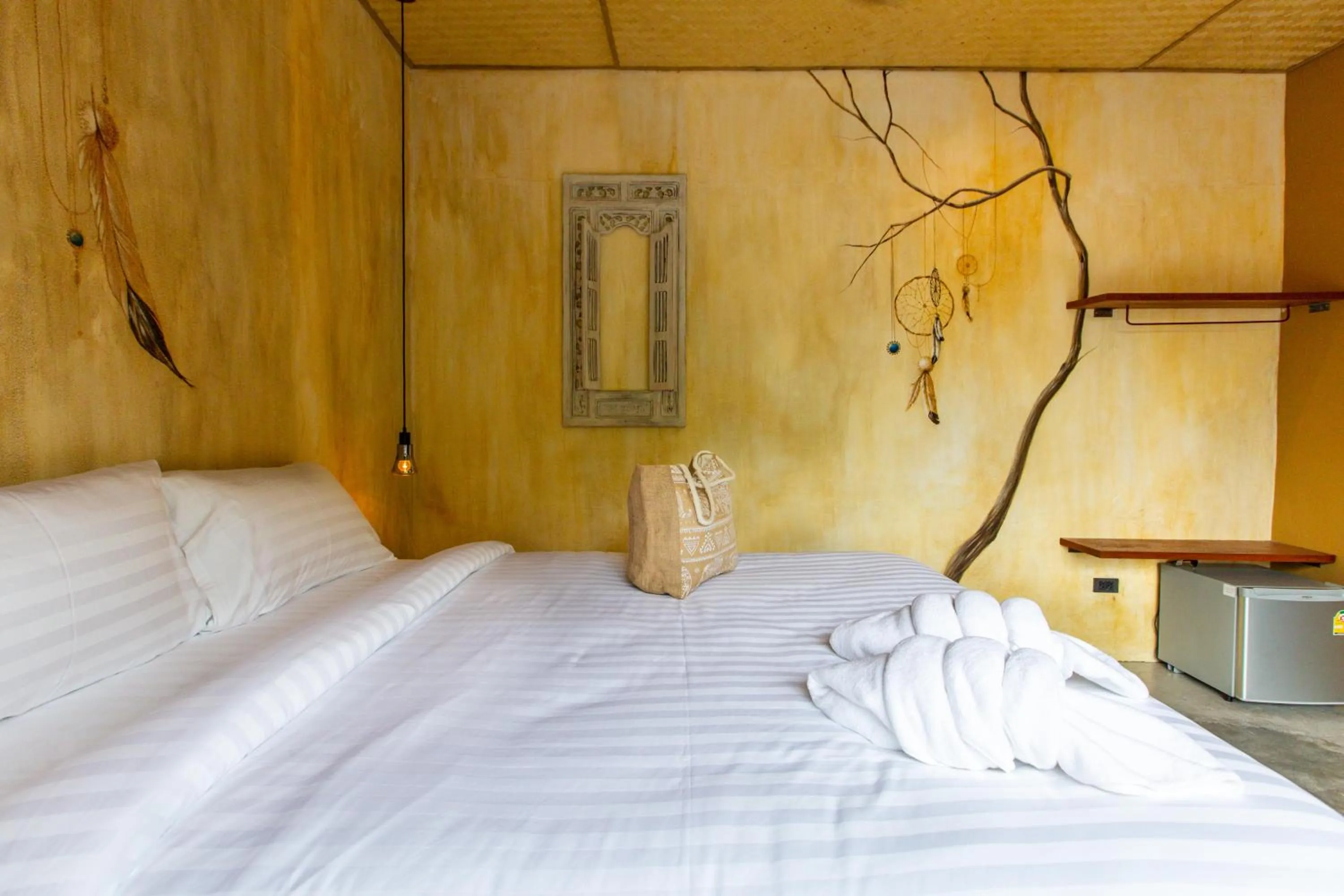 Bed in Dreamcatcher Boutique Hotel