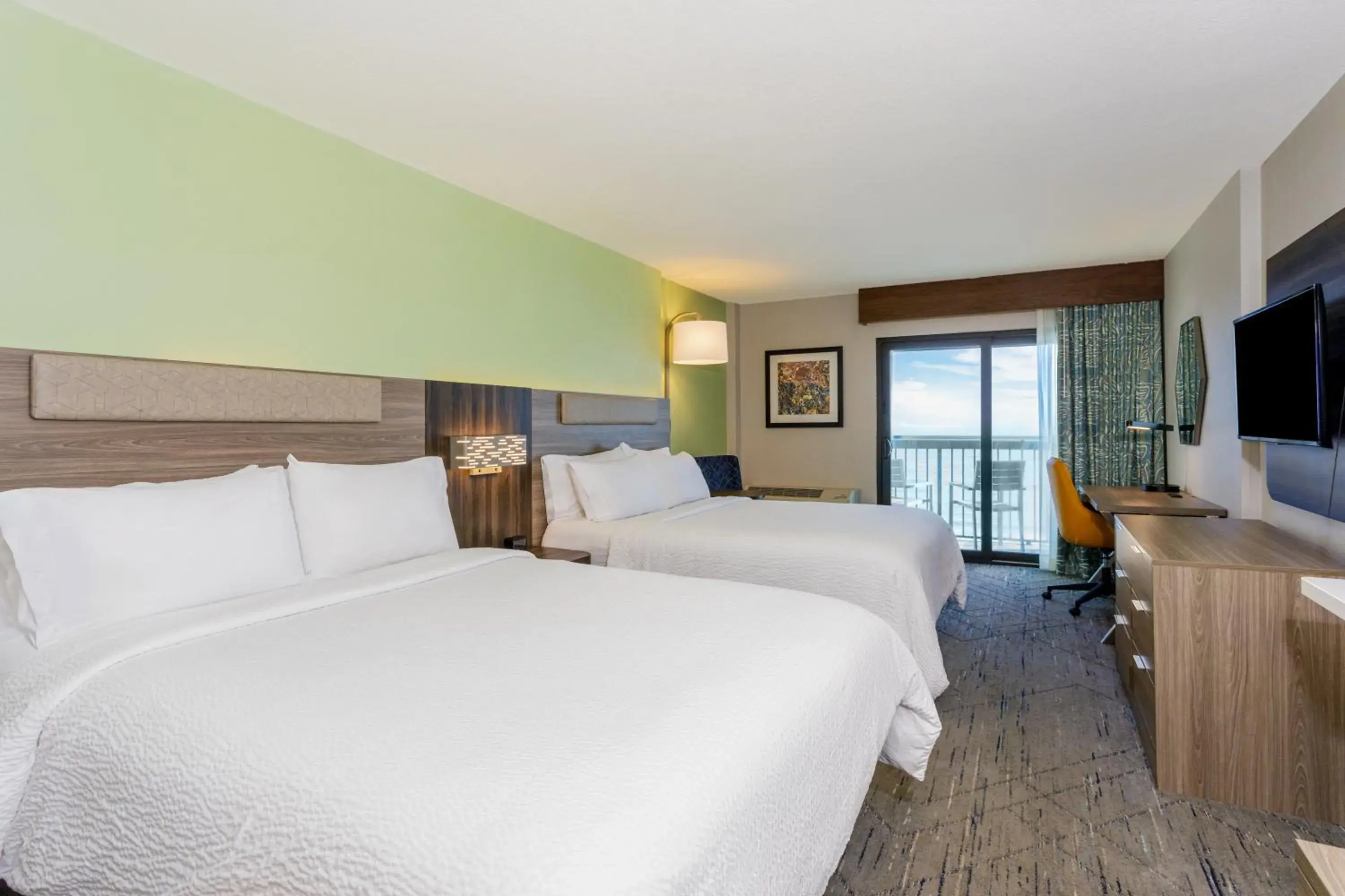 Bedroom, Bed in Holiday Inn Express & Suites Oceanfront Daytona Beach Shores by IHG Bedroom, Bed in Holiday Inn Express & Suites Oceanfront Daytona Beach Shores by IHG