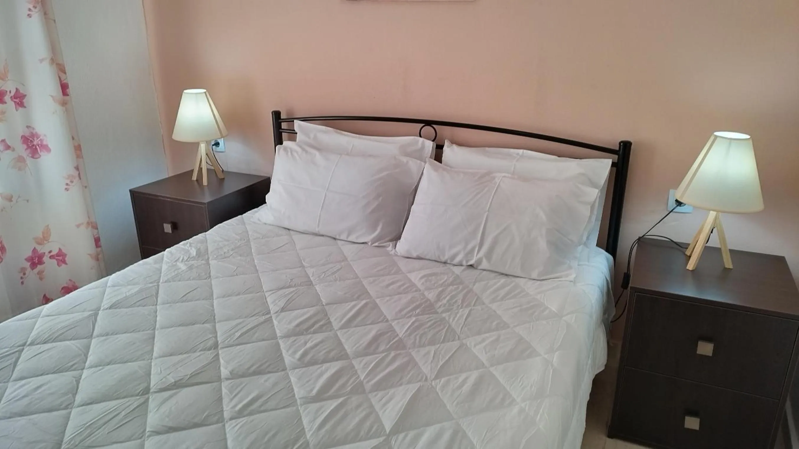 Bed in Koula Apartments