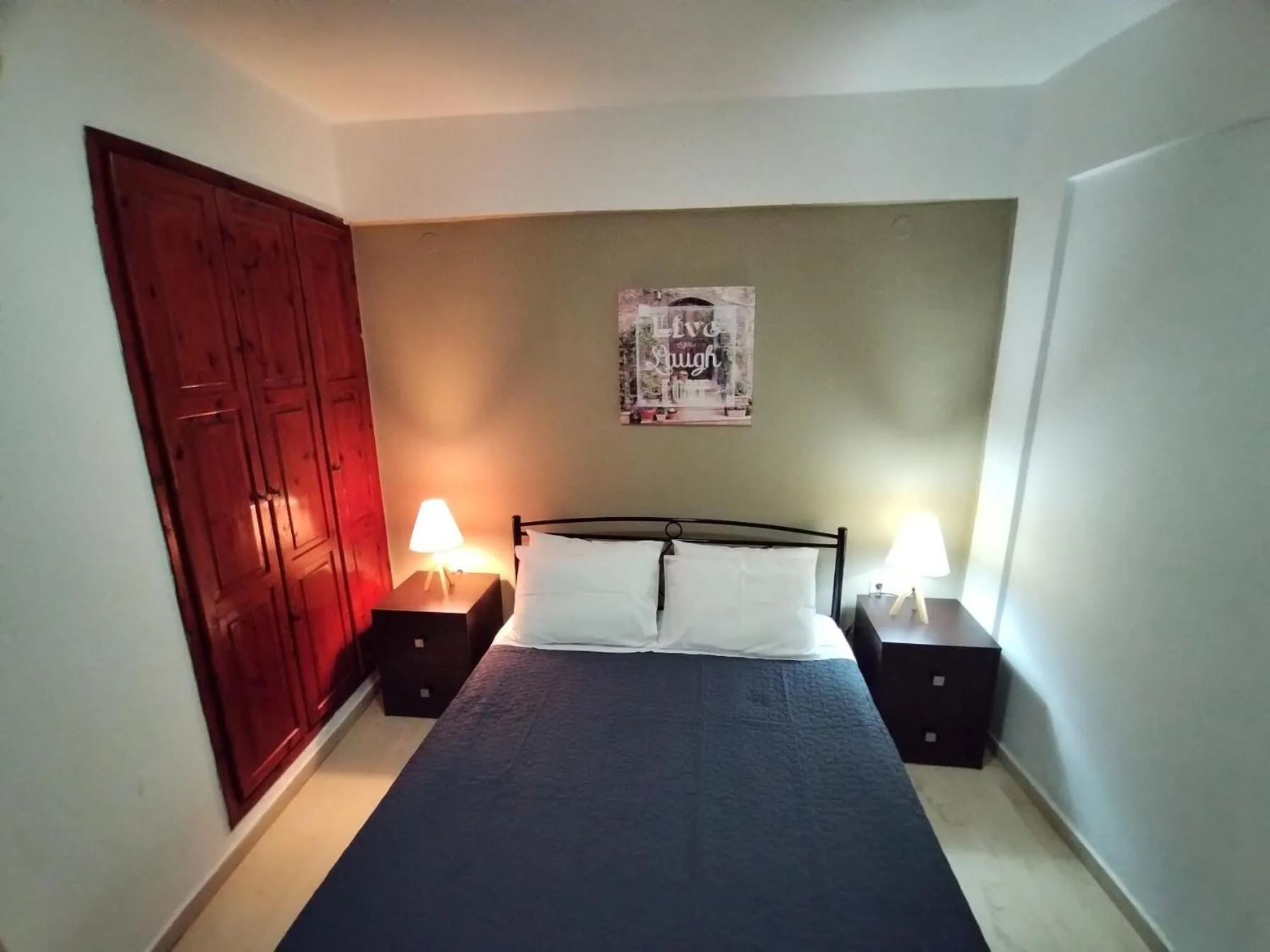 Bed in Koula Apartments