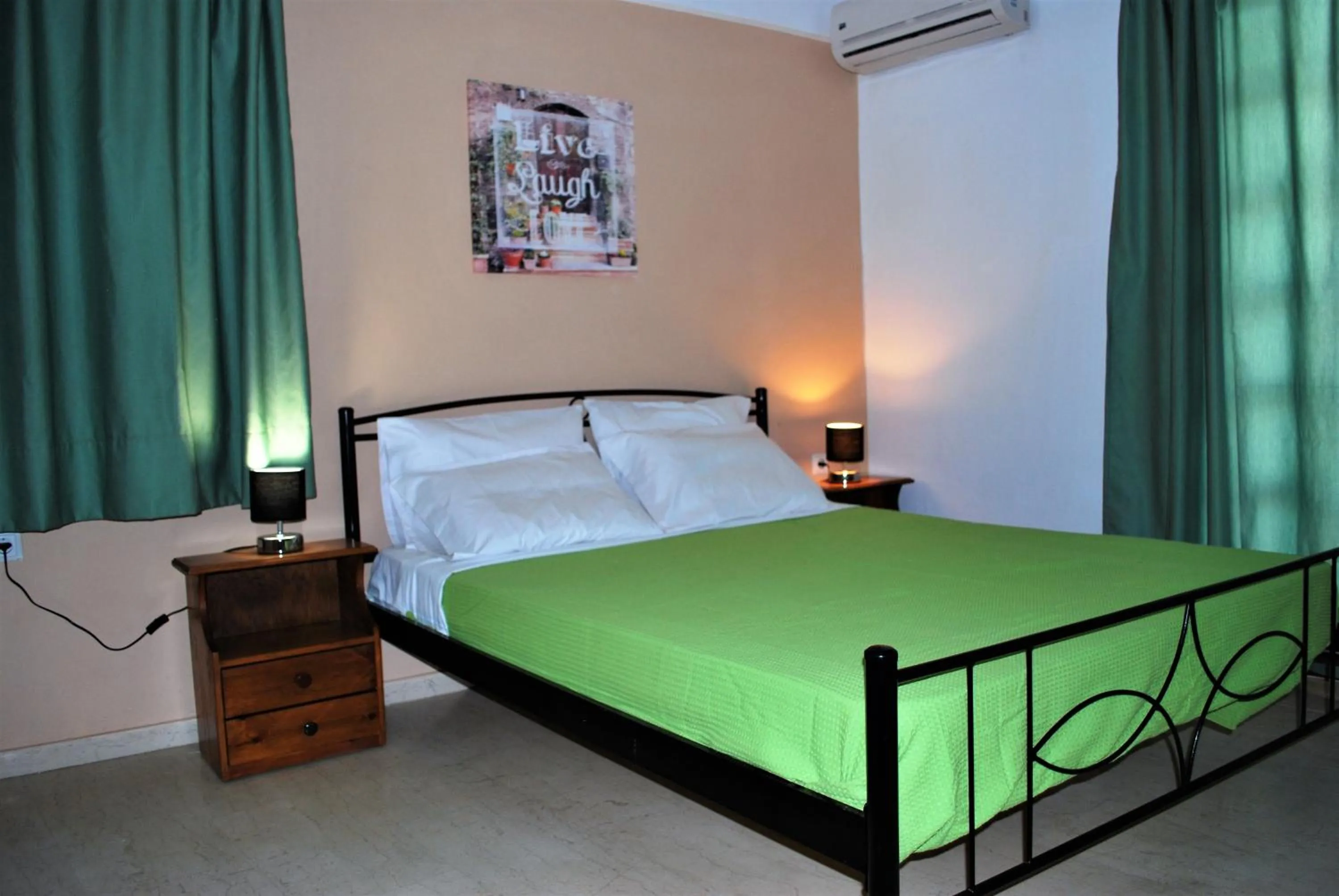 Bed in Koula Apartments