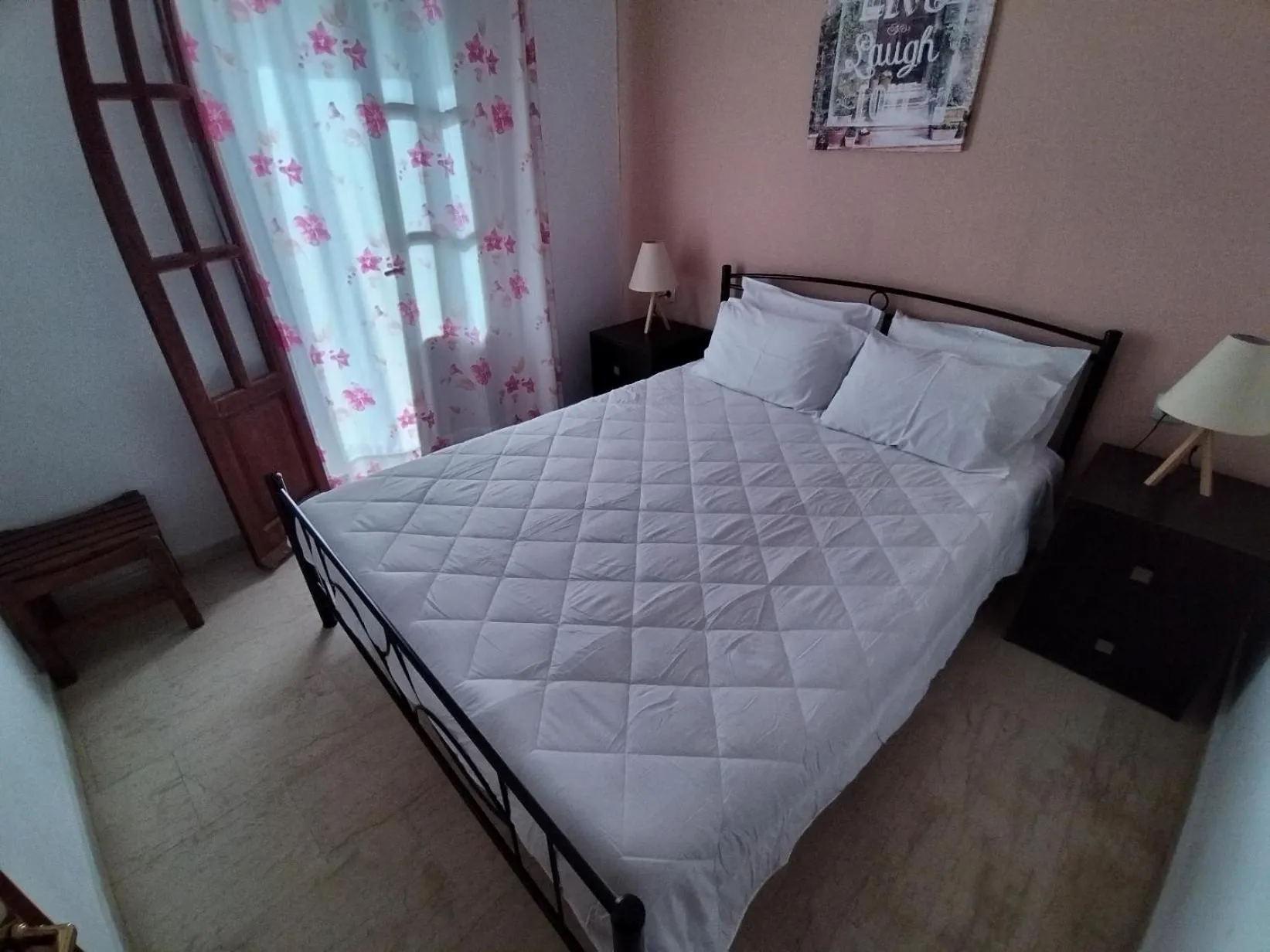 Bed in Koula Apartments