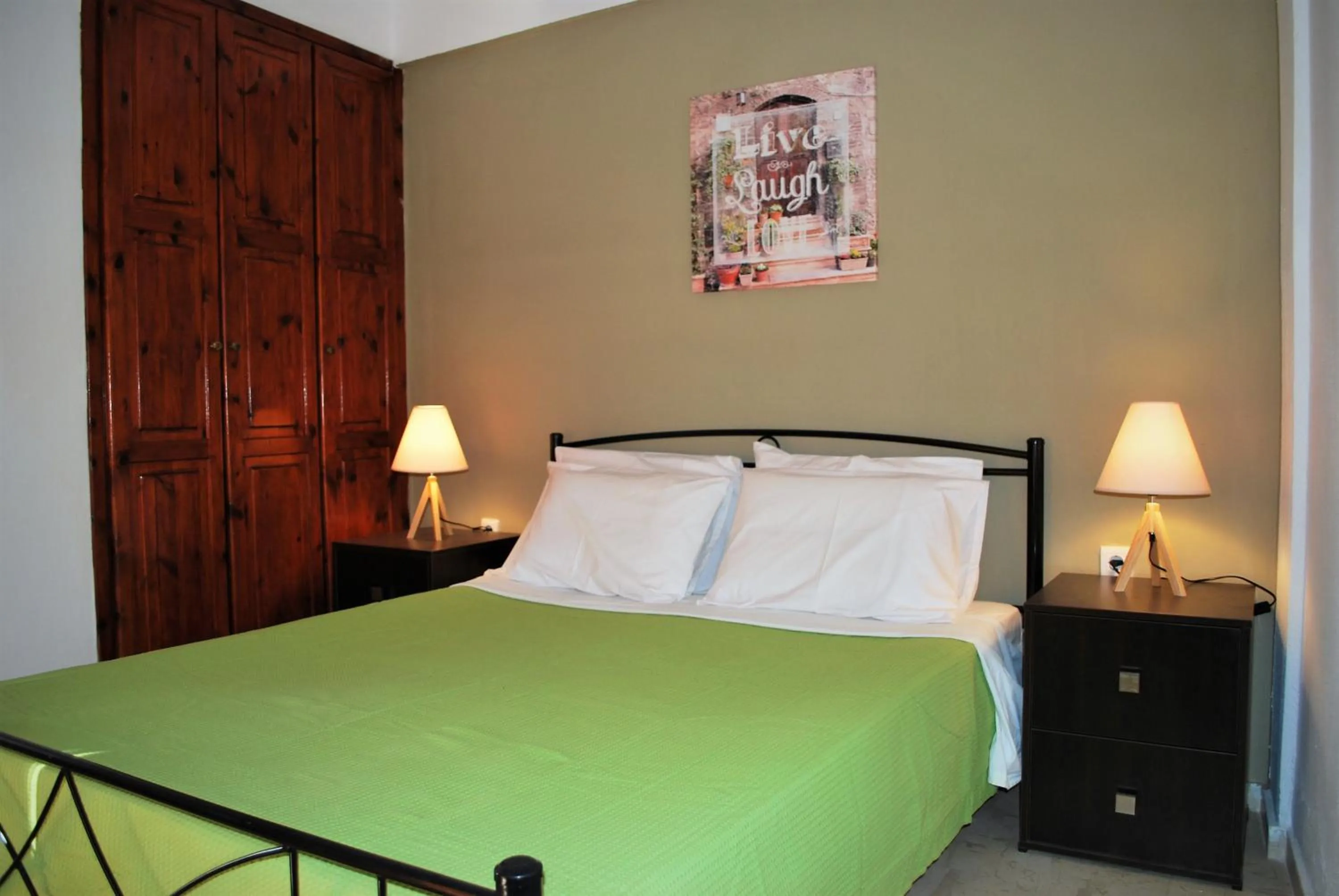 Bed in Koula Apartments