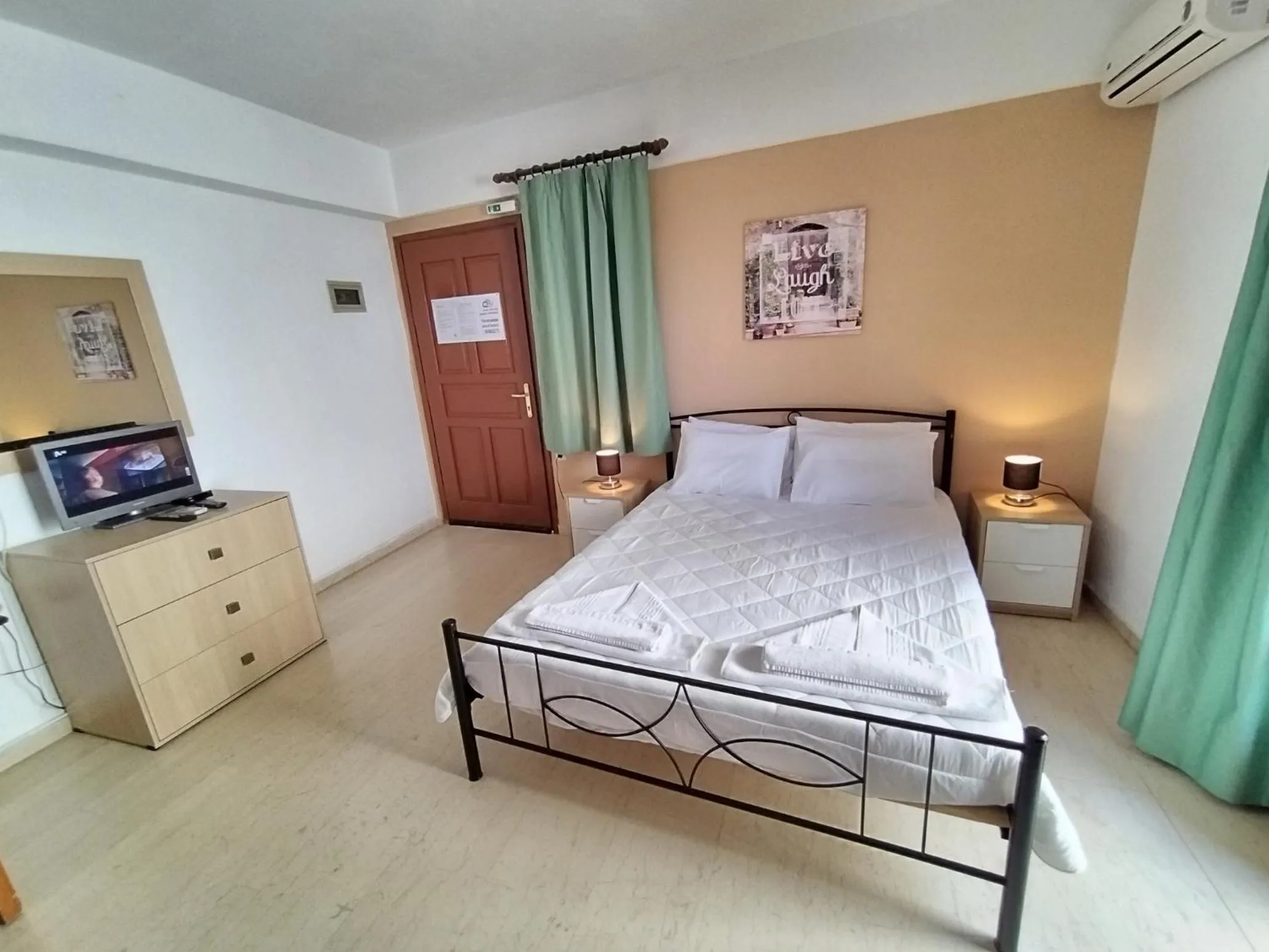 Bed in Koula Apartments