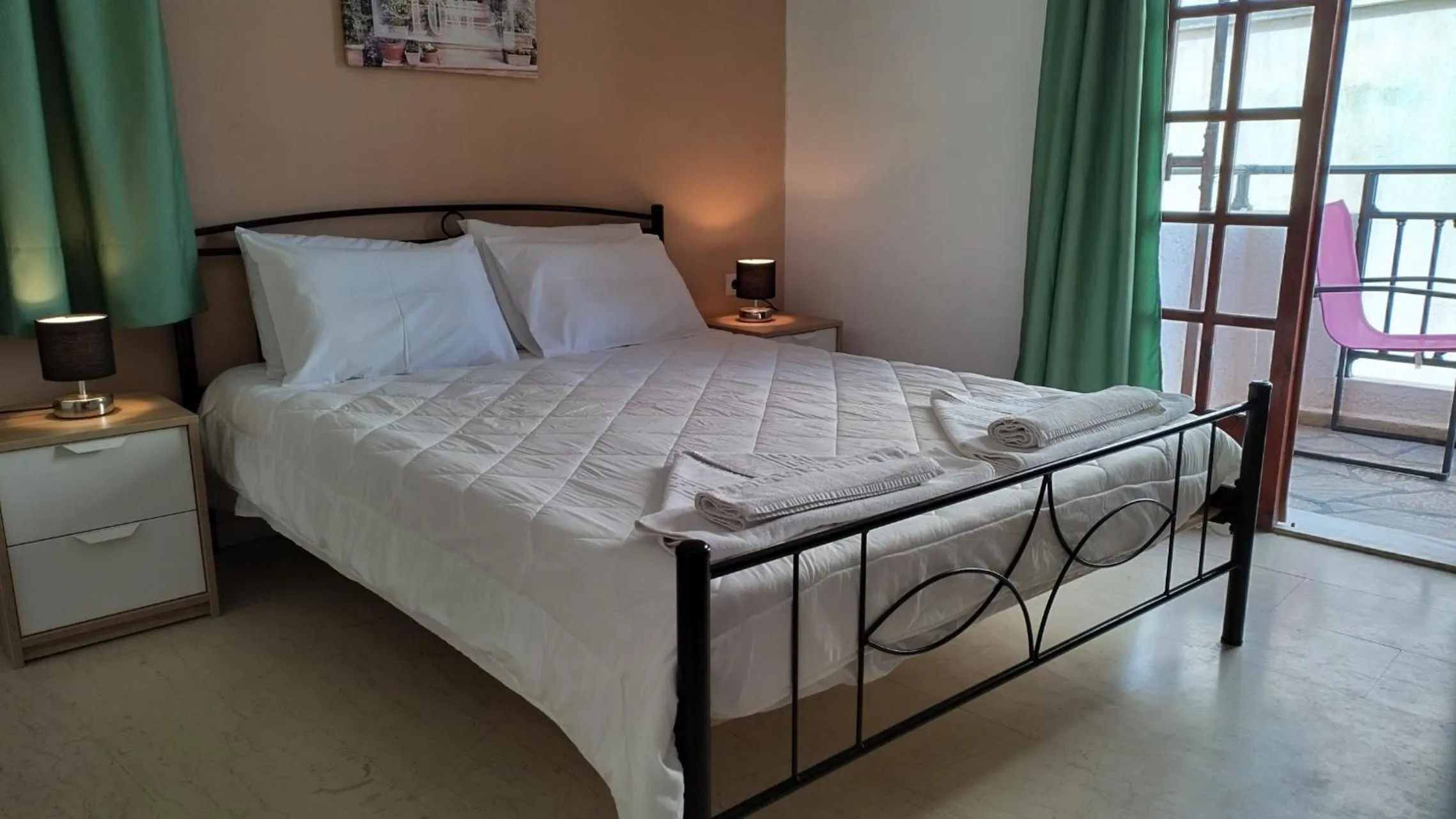 Bed in Koula Apartments