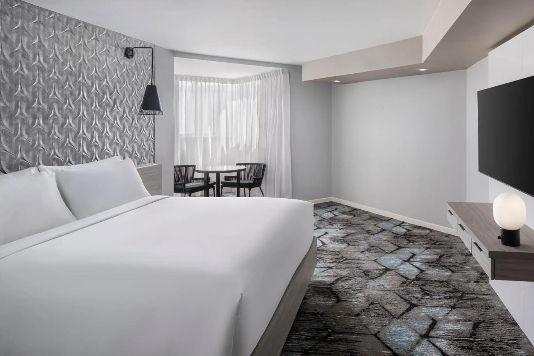 Bed in Renaissance Daytona Beach Oceanfront Hotel