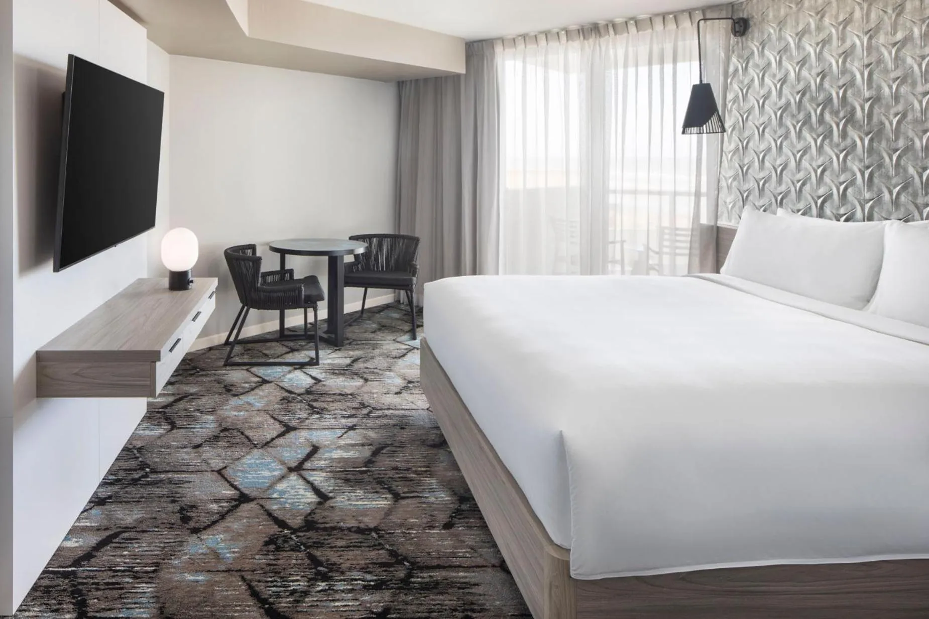 Bed in Renaissance Daytona Beach Oceanfront Hotel