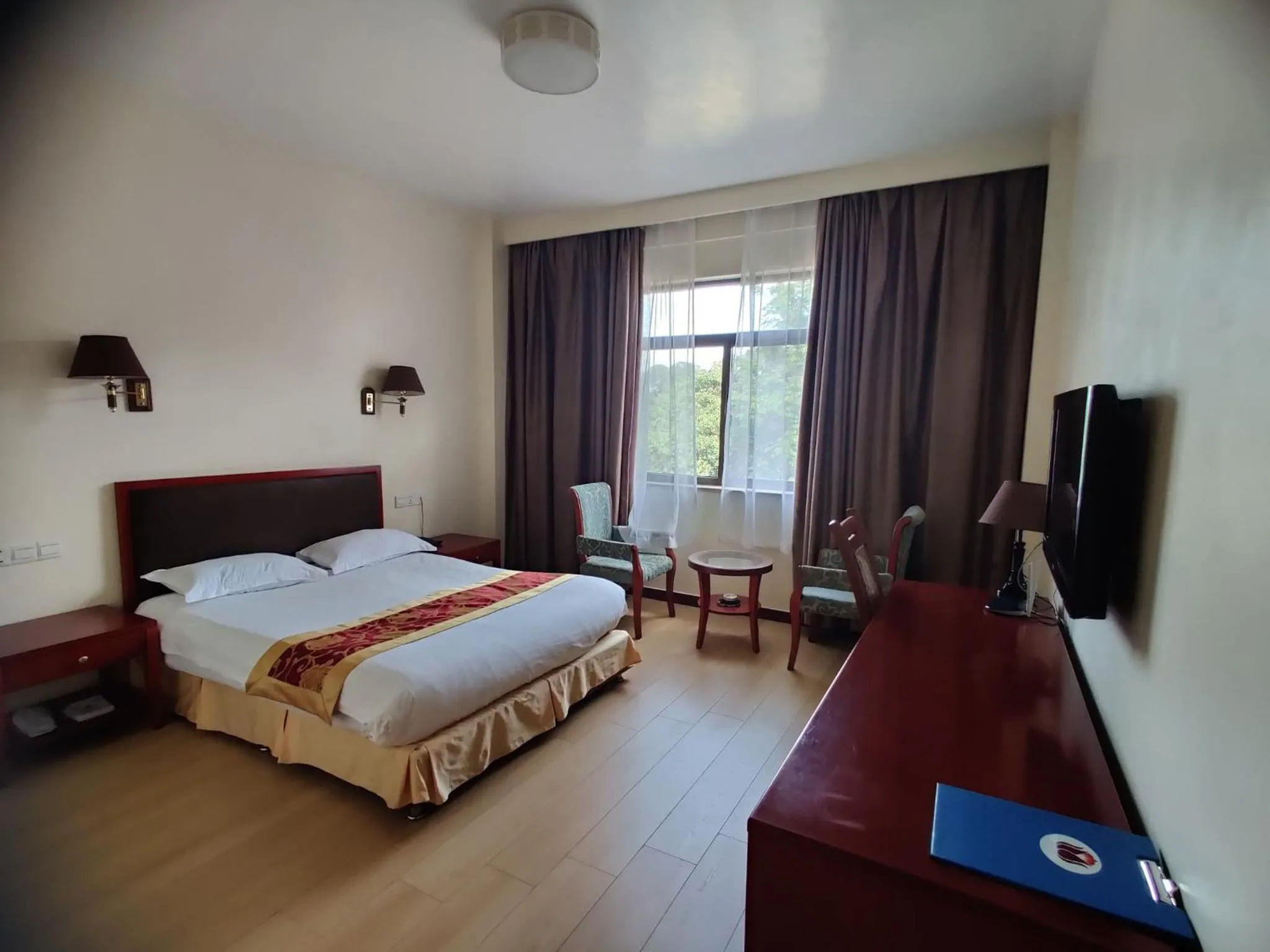 Bed in Soluxe Club International Hotel