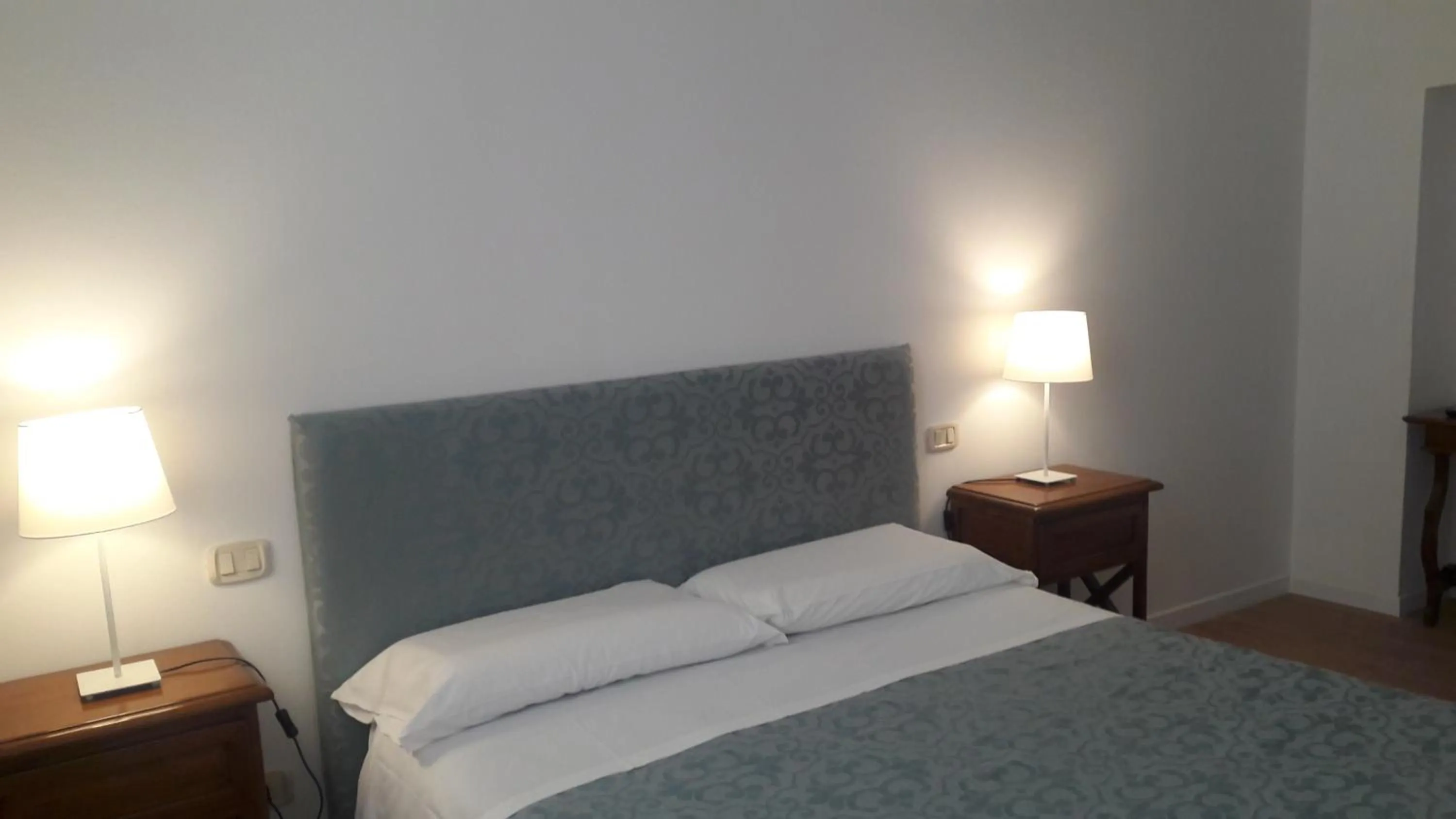 Bed in Il Grifo Camere e Suites