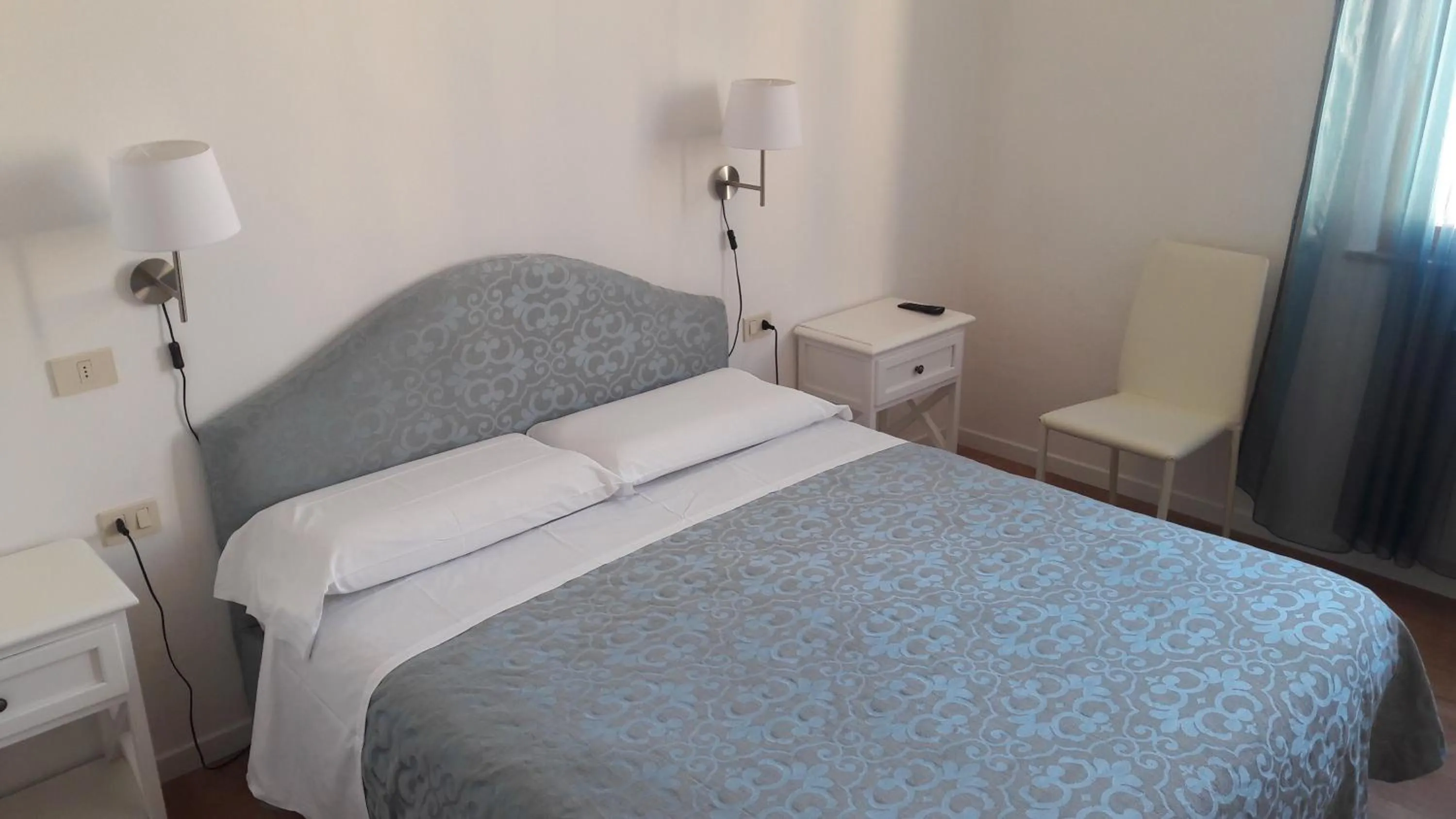Bed in Il Grifo Camere e Suites