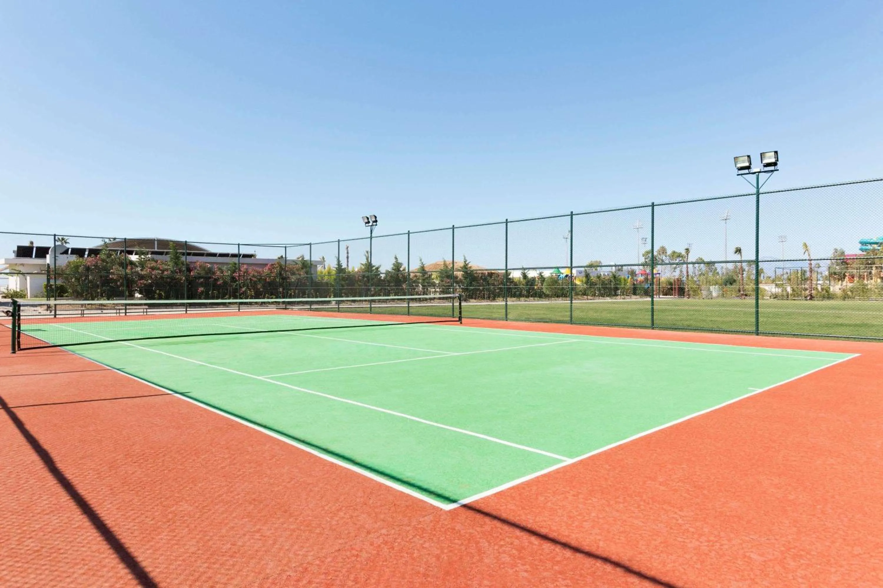 Tennis court in Ramada Resort By Wyndham Lara