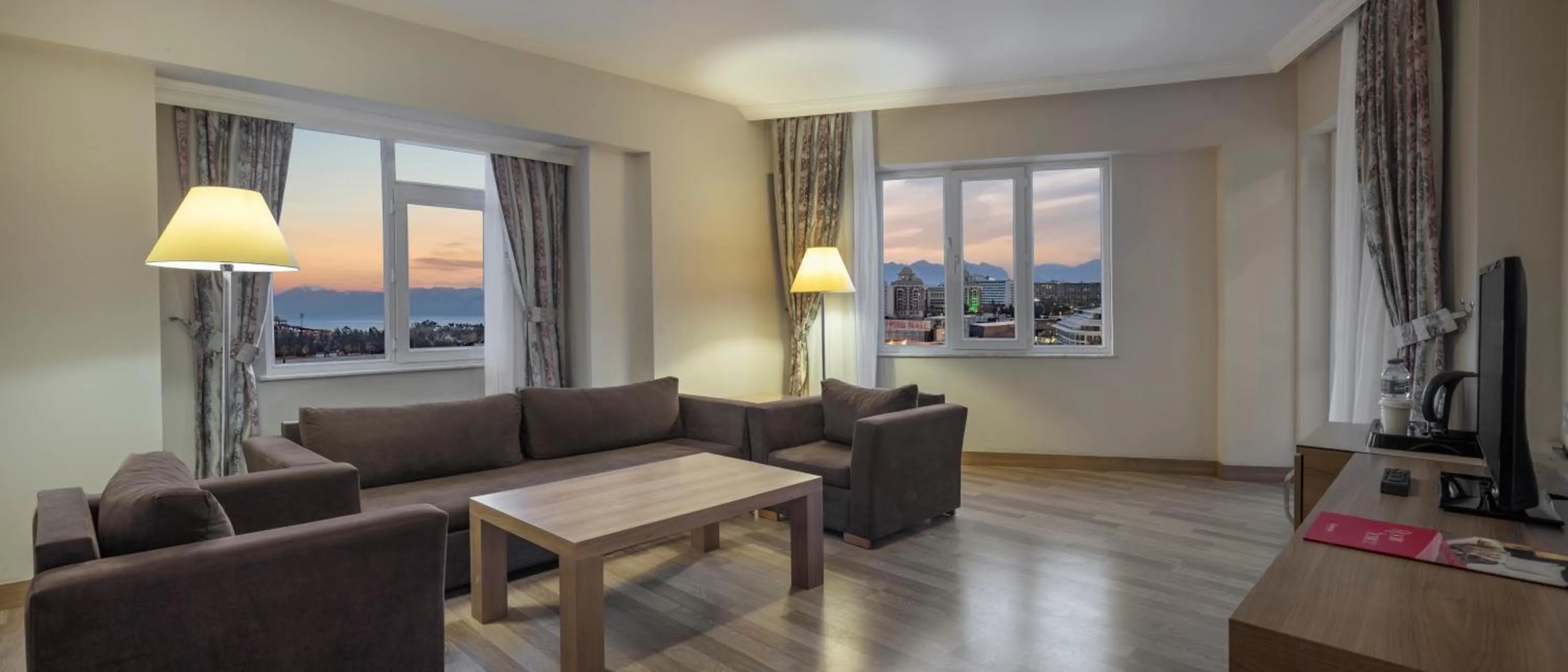 Communal lounge/ TV room in Ramada Resort By Wyndham Lara