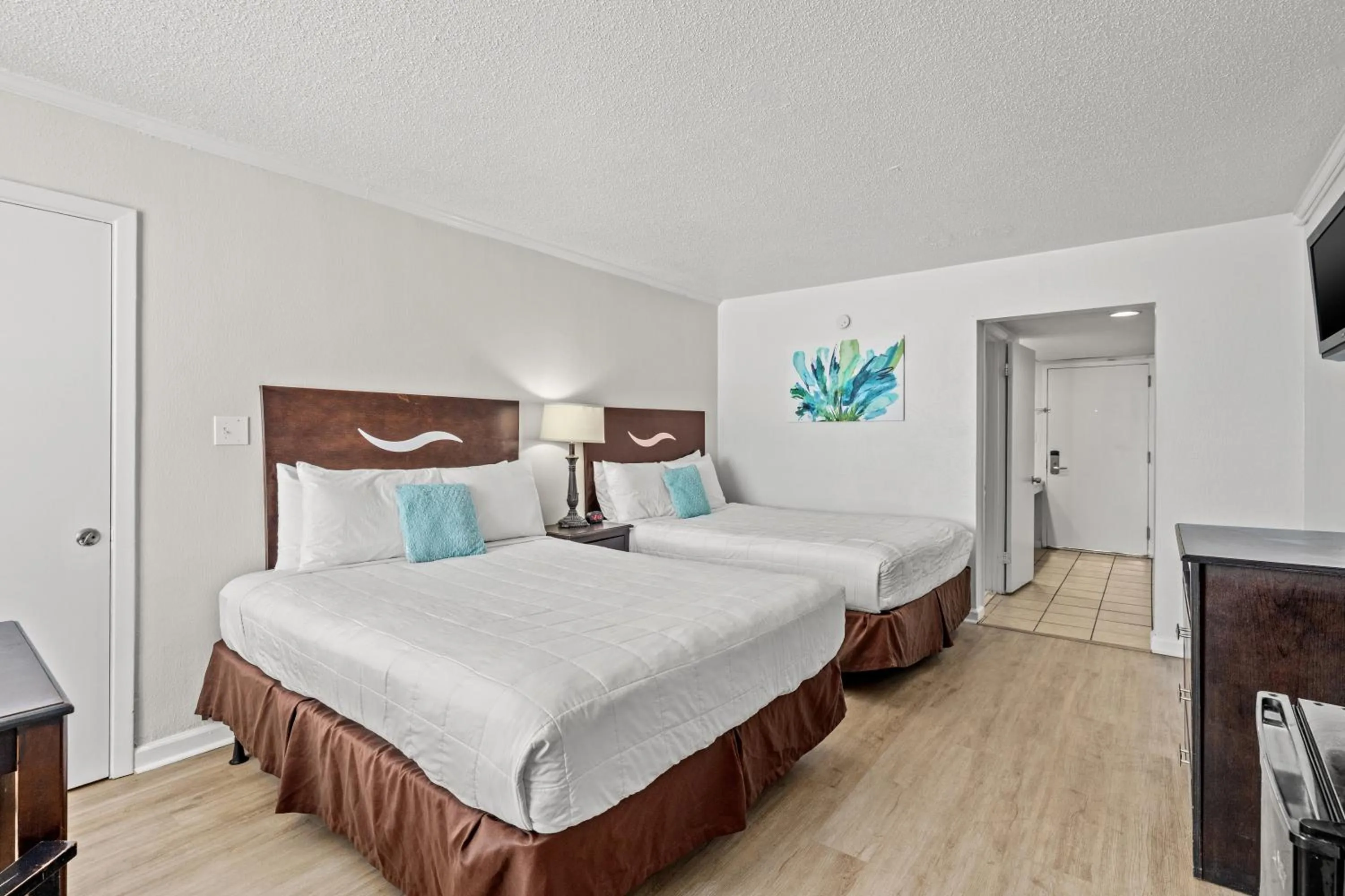 Photo of the whole room, Bed in The Reef At Seahaven Beach Resorts