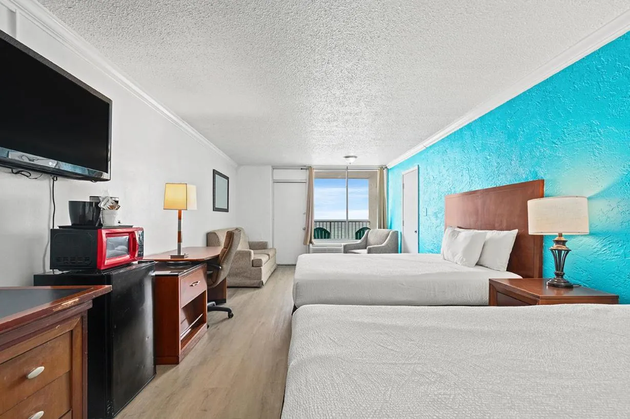 Photo of the whole room, Bed in The Reef At Seahaven Beach Resorts