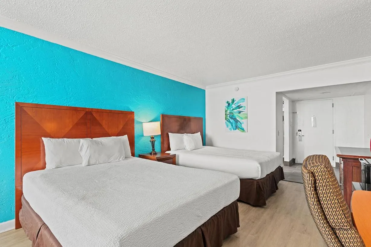 Photo of the whole room, Bed in The Reef At Seahaven Beach Resorts