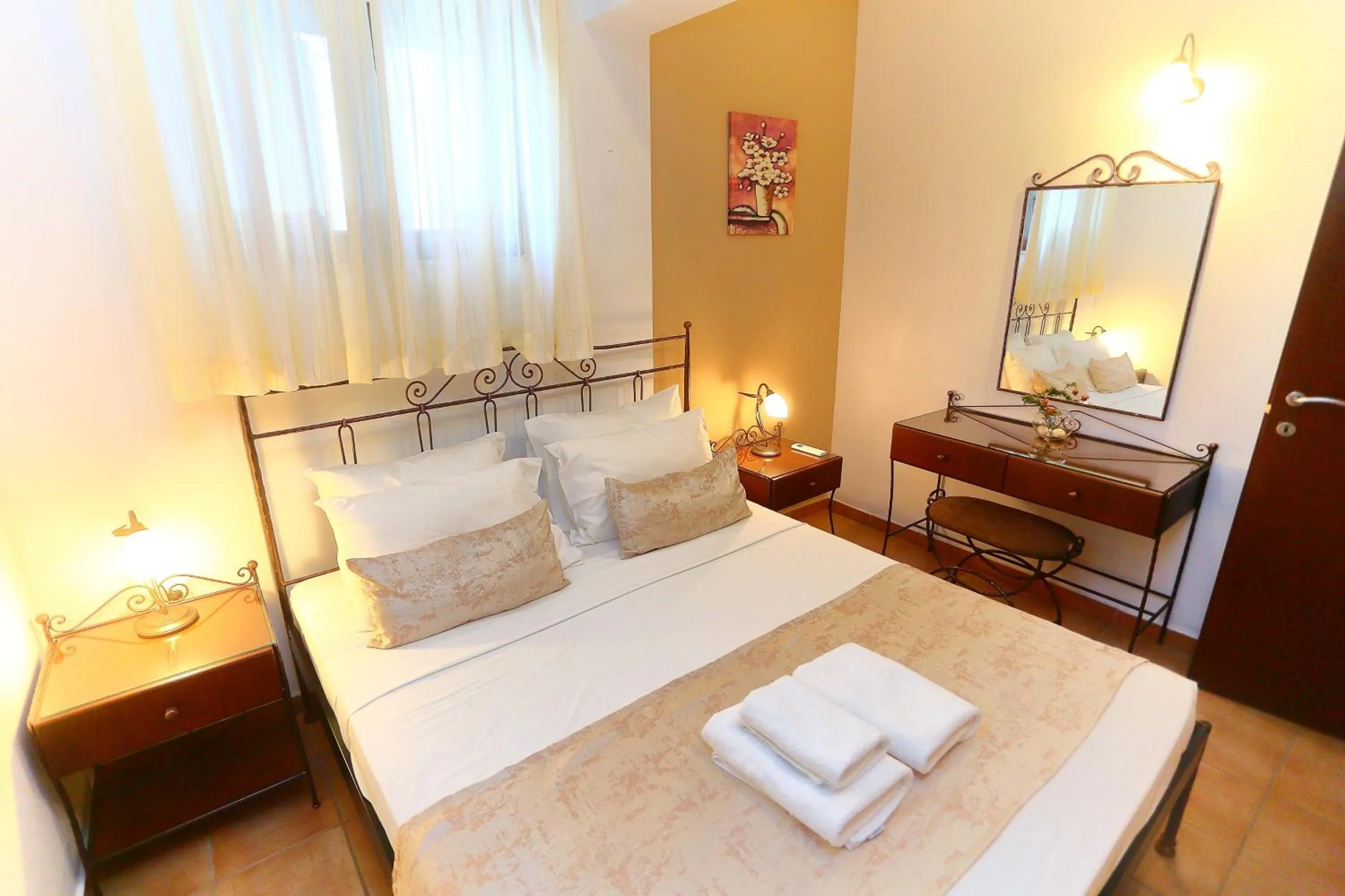 Bed in Vathi Hotel Apartment Hotel