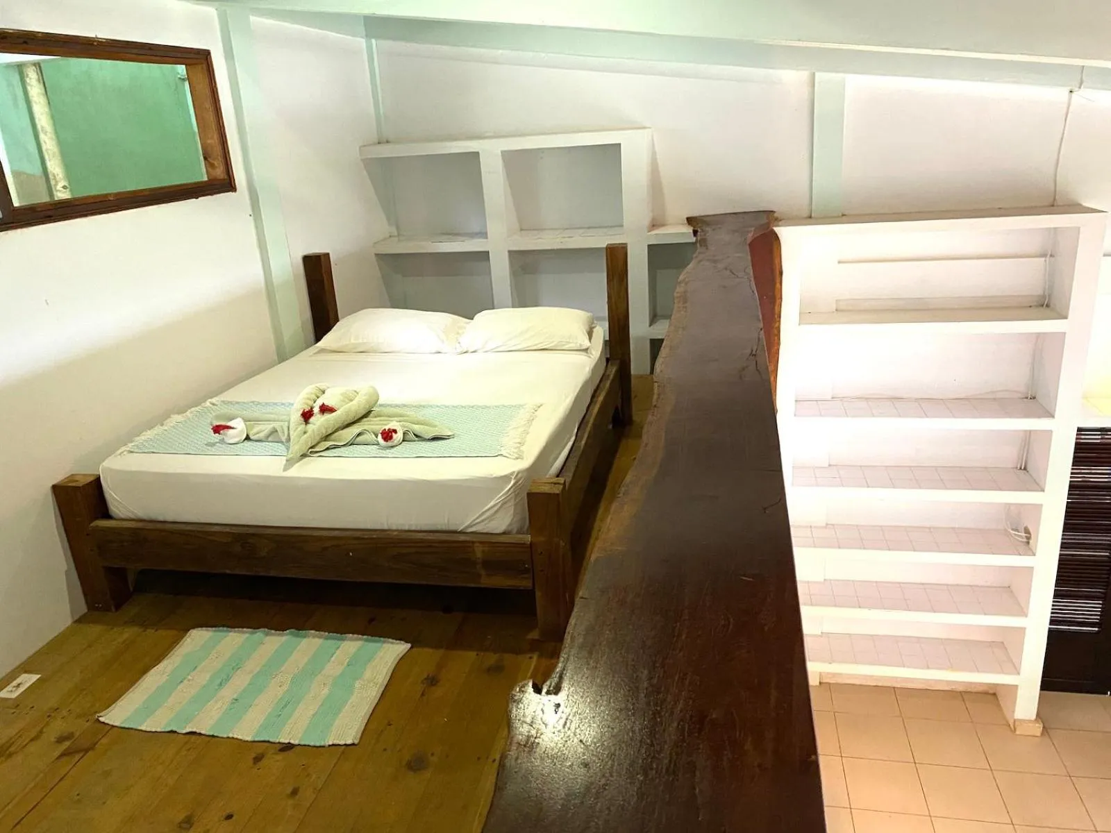 Bed in Bird Island Bungalows