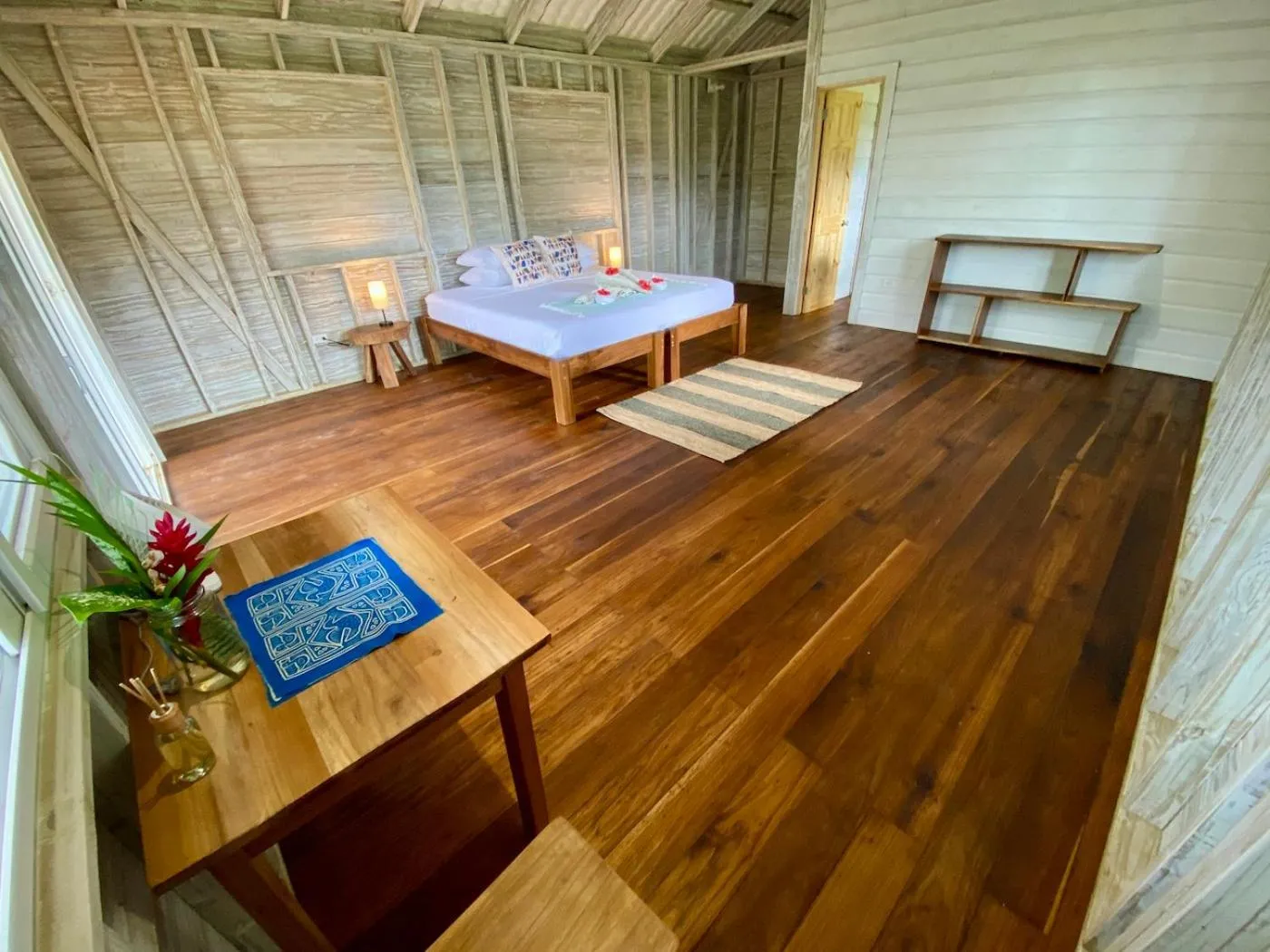 Bed in Bird Island Bungalows