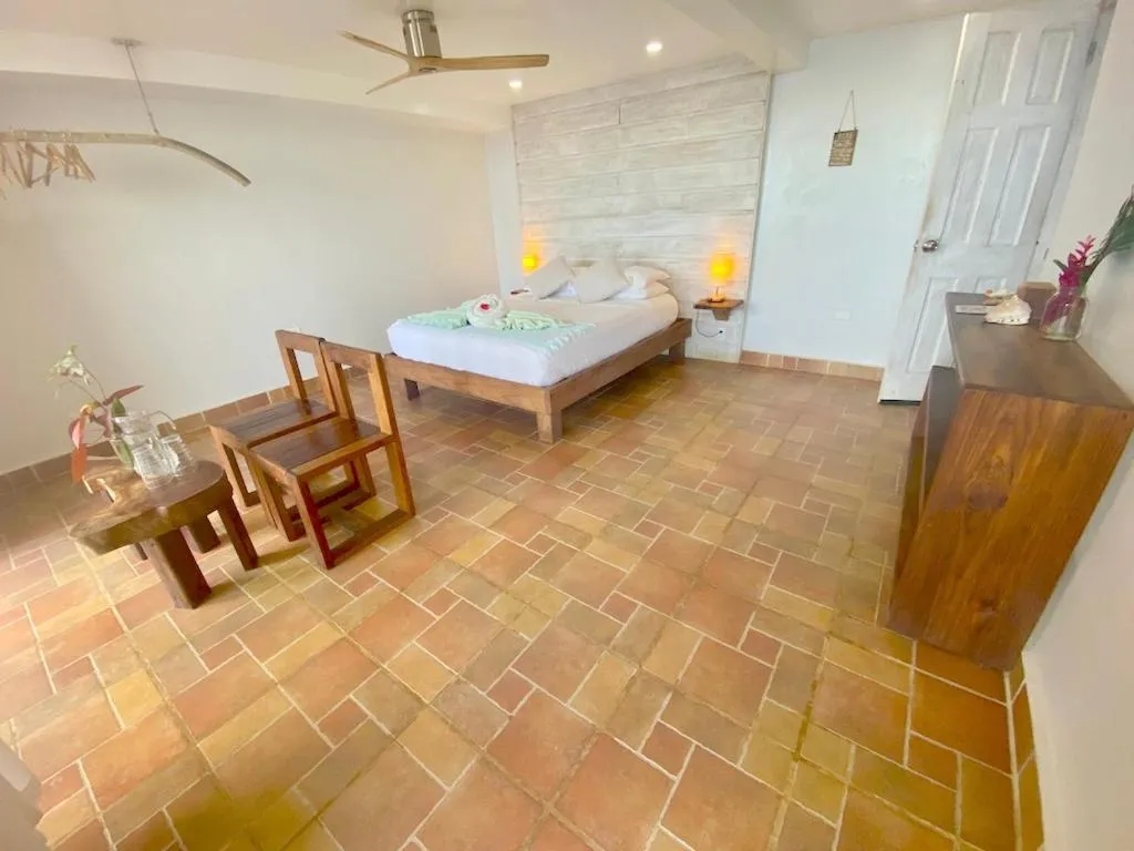 Bed in Bird Island Bungalows