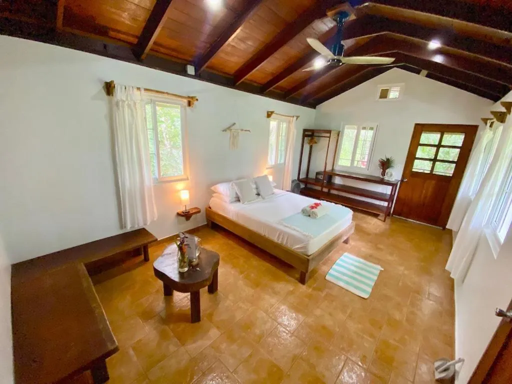 Living room, Bed in Bird Island Bungalows