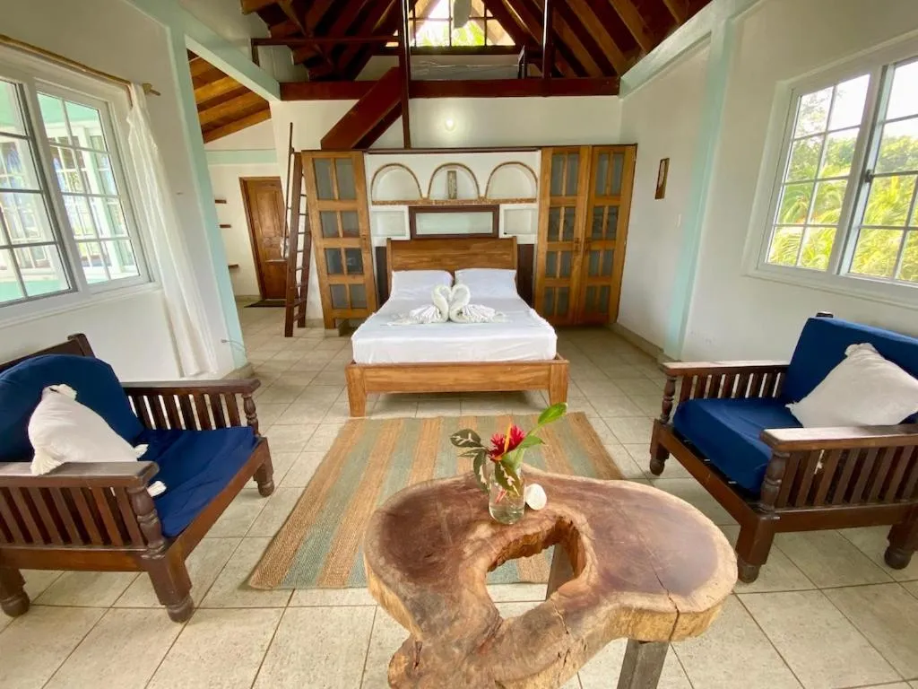 Bed in Bird Island Bungalows