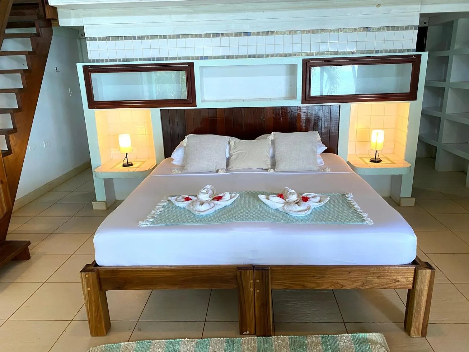 Bed in Bird Island Bungalows
