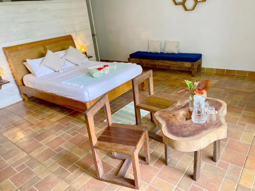 Bed in Bird Island Bungalows