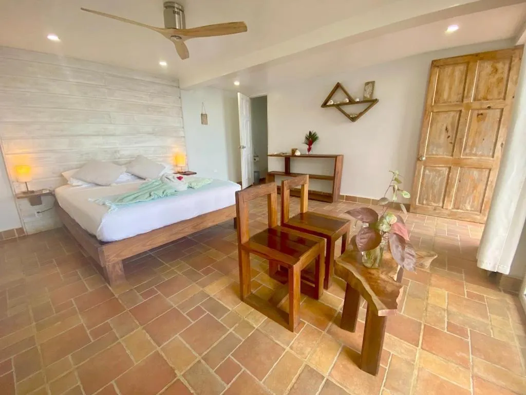 Bed in Bird Island Bungalows