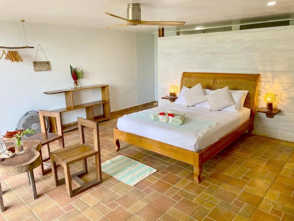Bed in Bird Island Bungalows