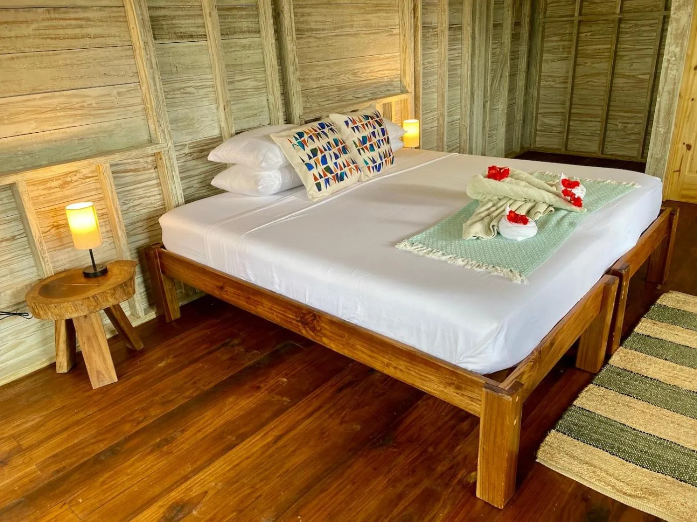 Bed in Bird Island Bungalows