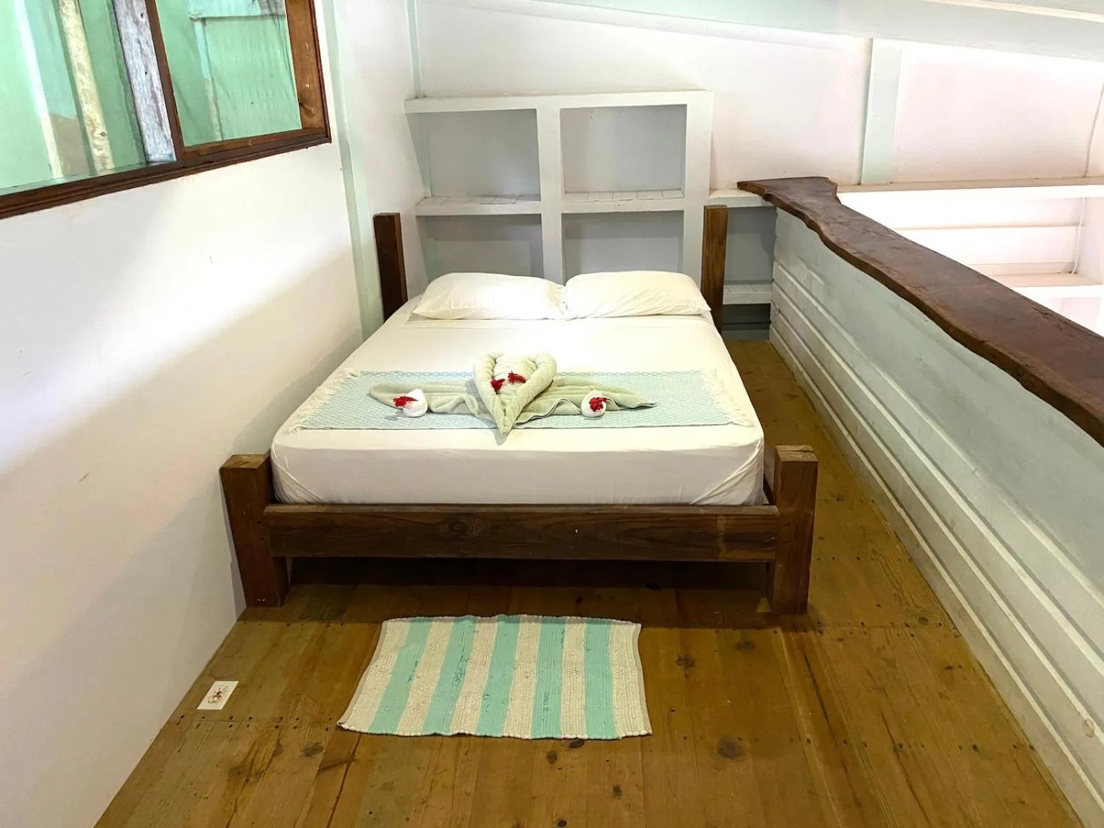 Bed in Bird Island Bungalows