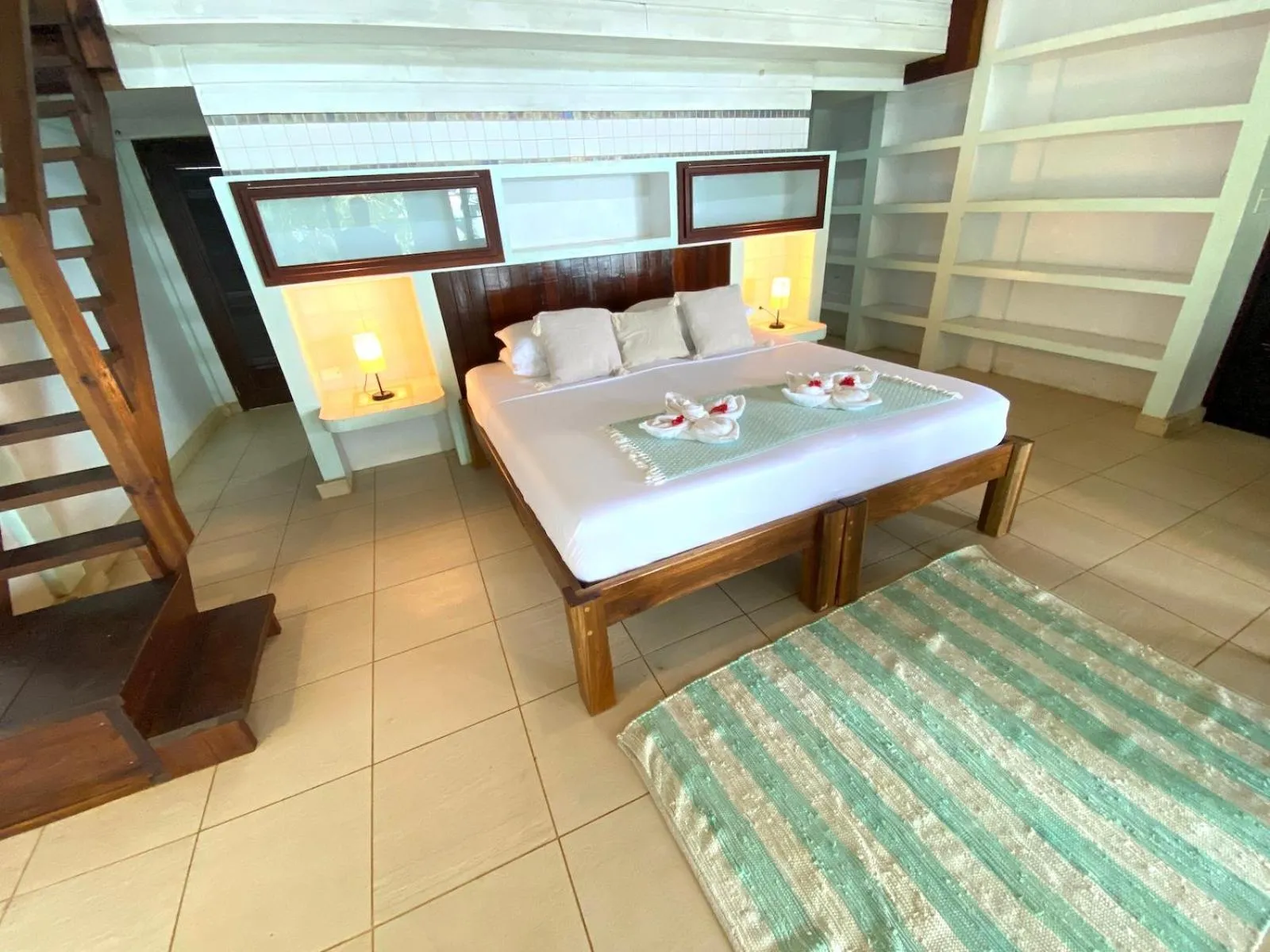 Bed in Bird Island Bungalows