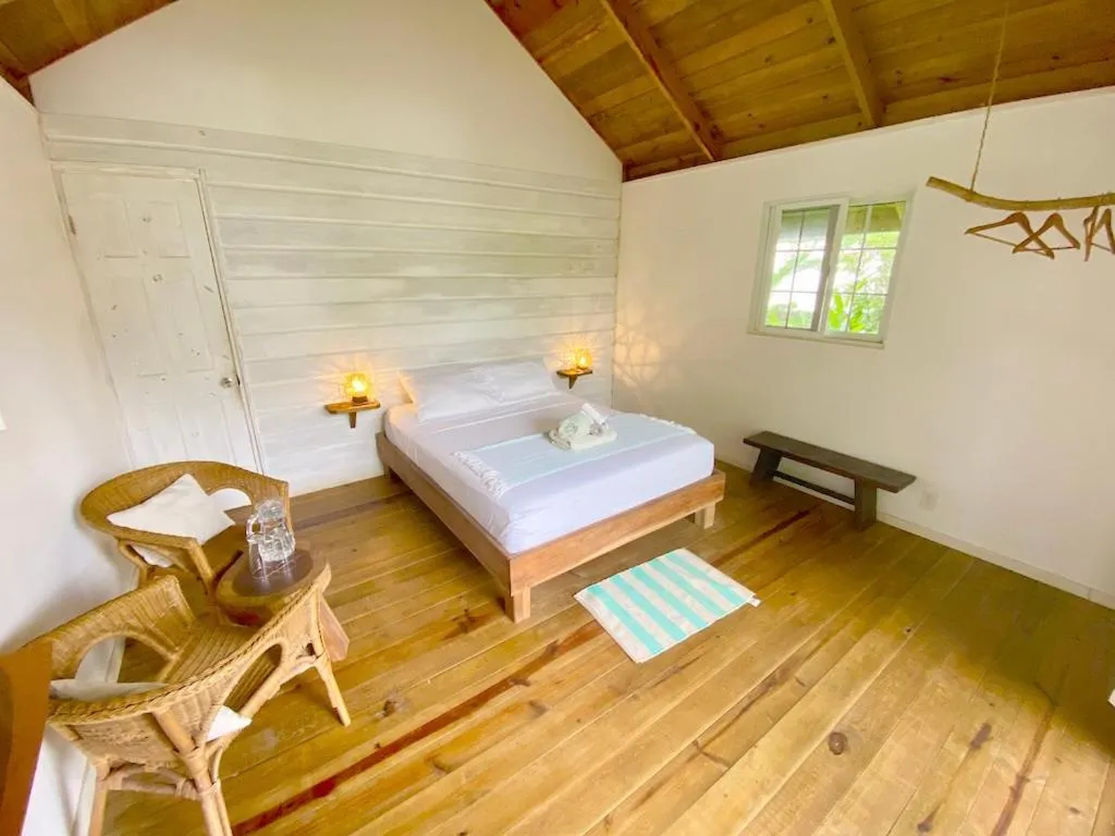 Bed in Bird Island Bungalows