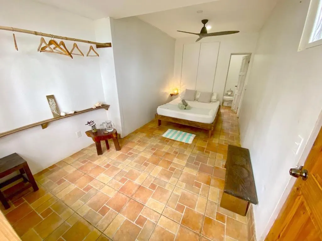 Bed in Bird Island Bungalows