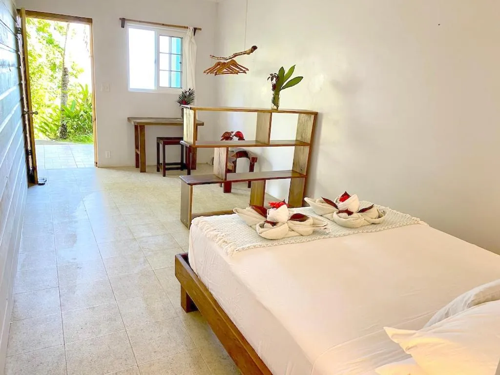 Bed in Bird Island Bungalows