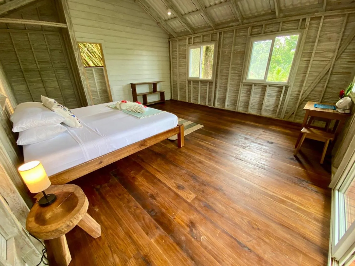 Bed in Bird Island Bungalows