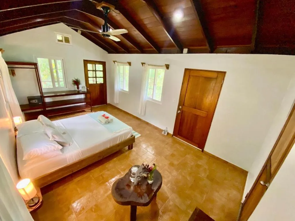 Photo of the whole room, Bed in Bird Island Bungalows