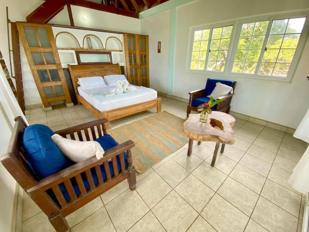 Bed in Bird Island Bungalows