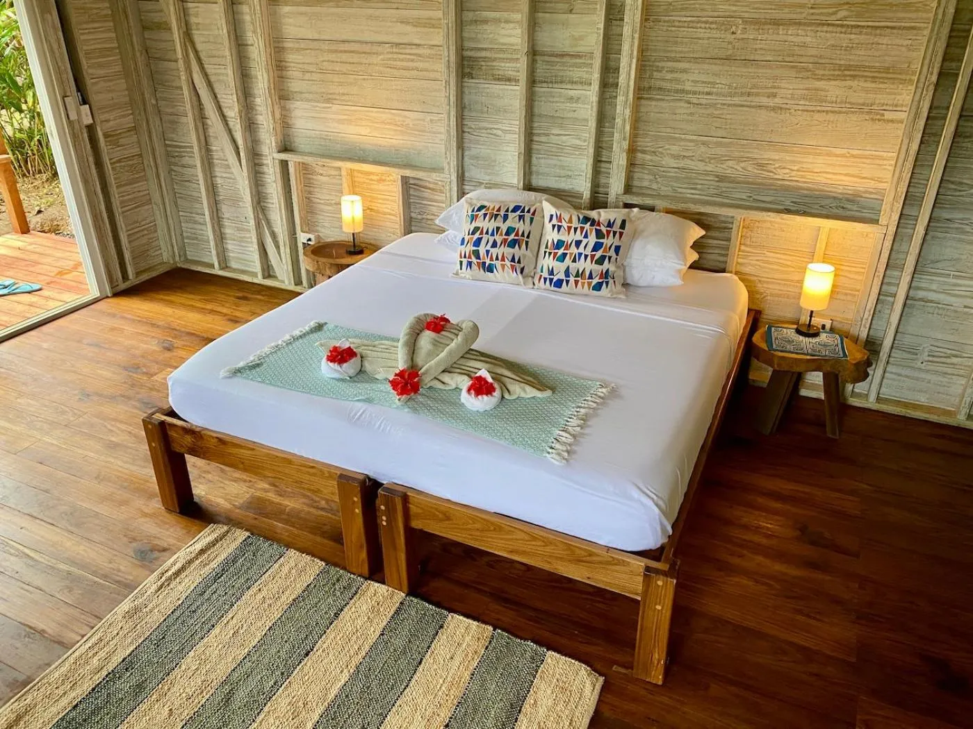 Bed in Bird Island Bungalows