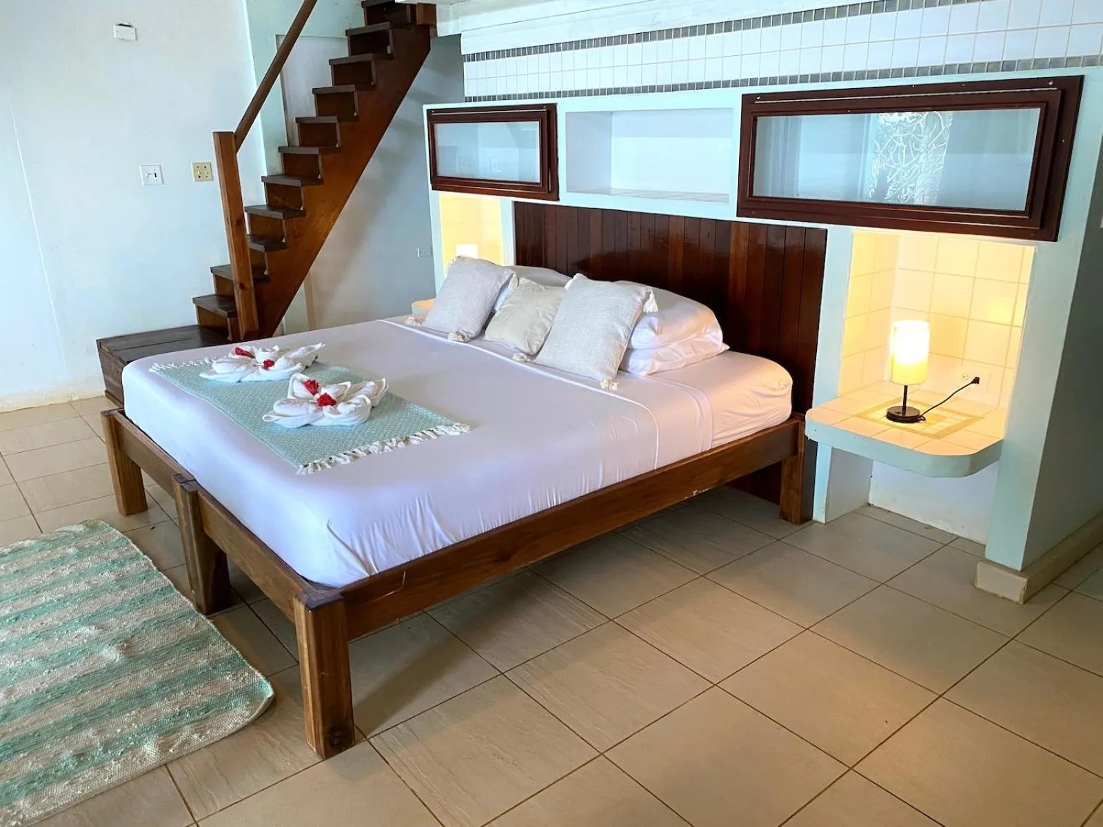 Bed in Bird Island Bungalows