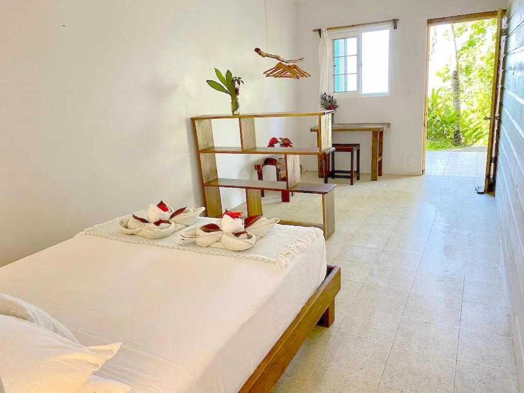 Bed in Bird Island Bungalows