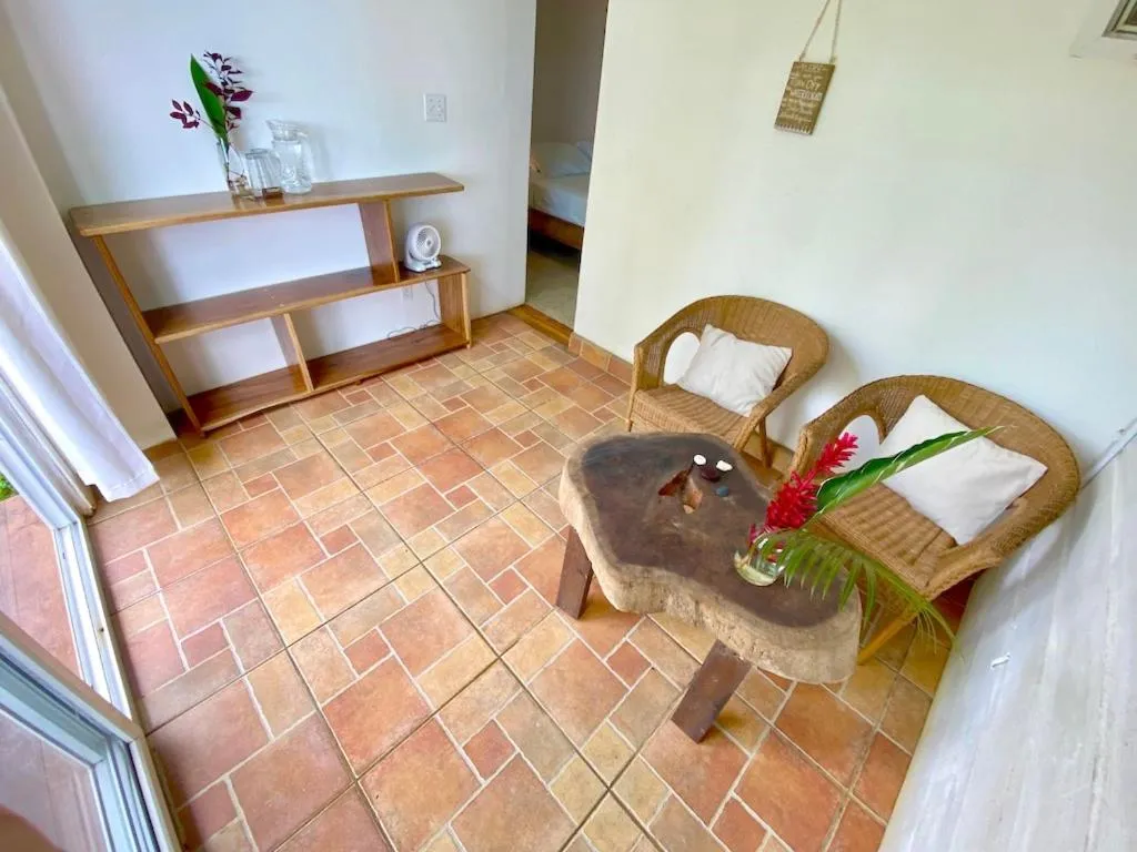 Bed in Bird Island Bungalows