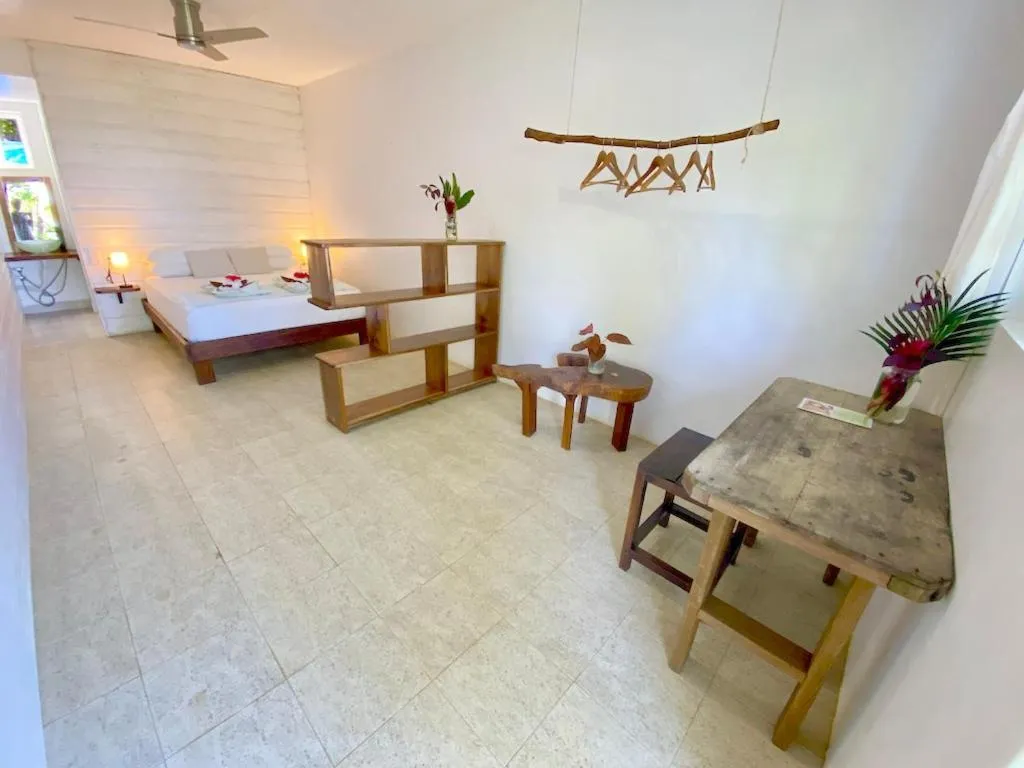 Bed in Bird Island Bungalows