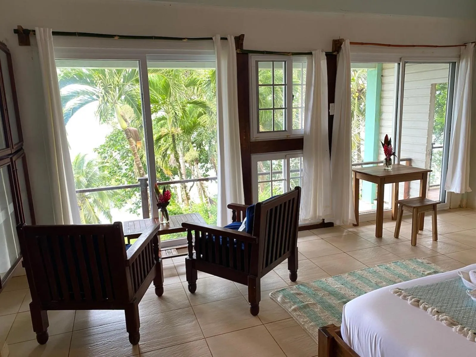 Bed in Bird Island Bungalows