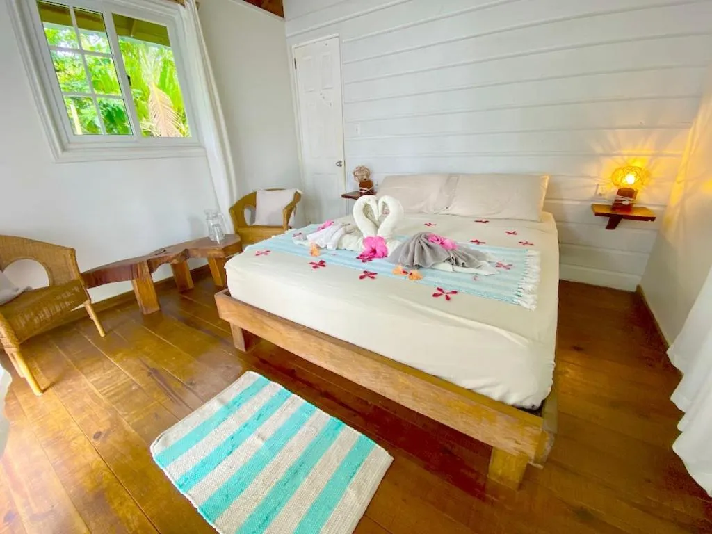 Bed in Bird Island Bungalows