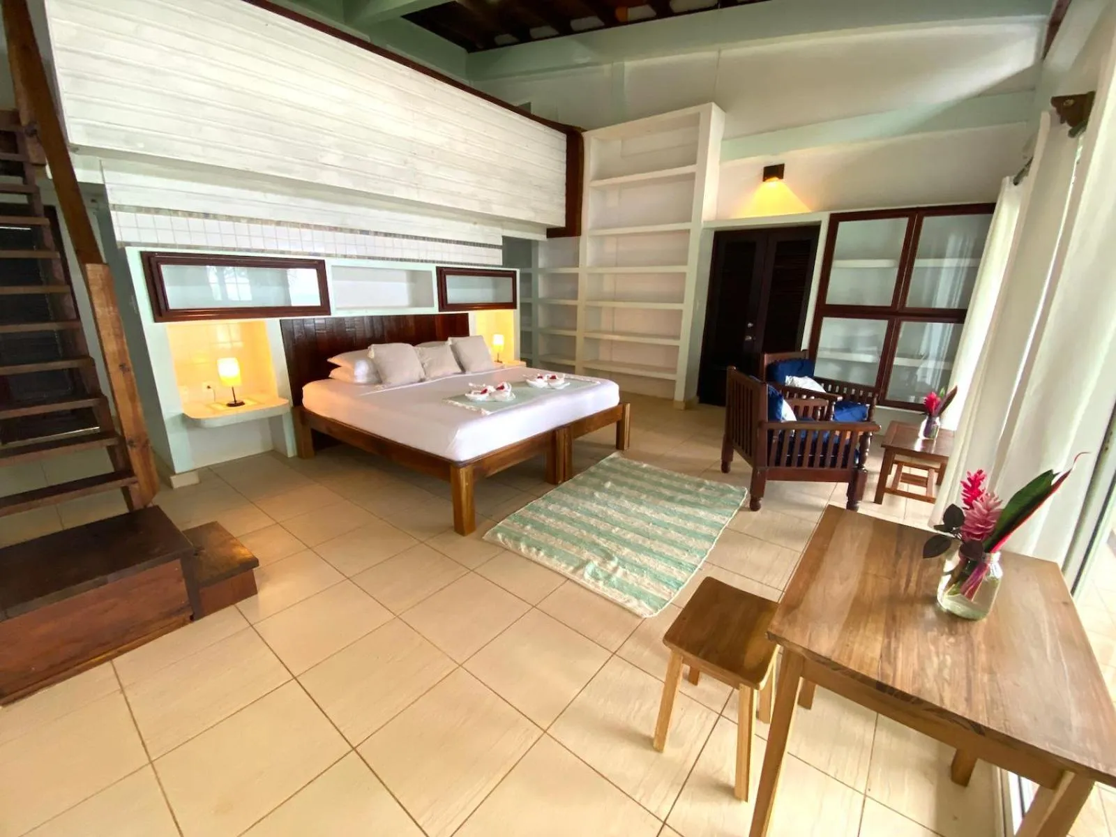 Bed in Bird Island Bungalows