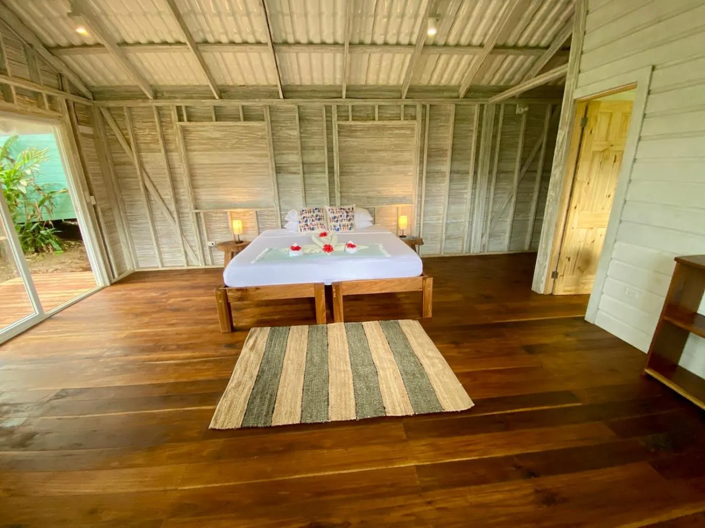 Bed in Bird Island Bungalows