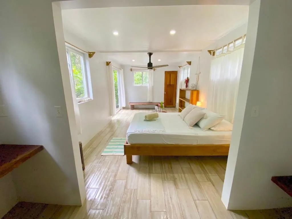 Bed in Bird Island Bungalows