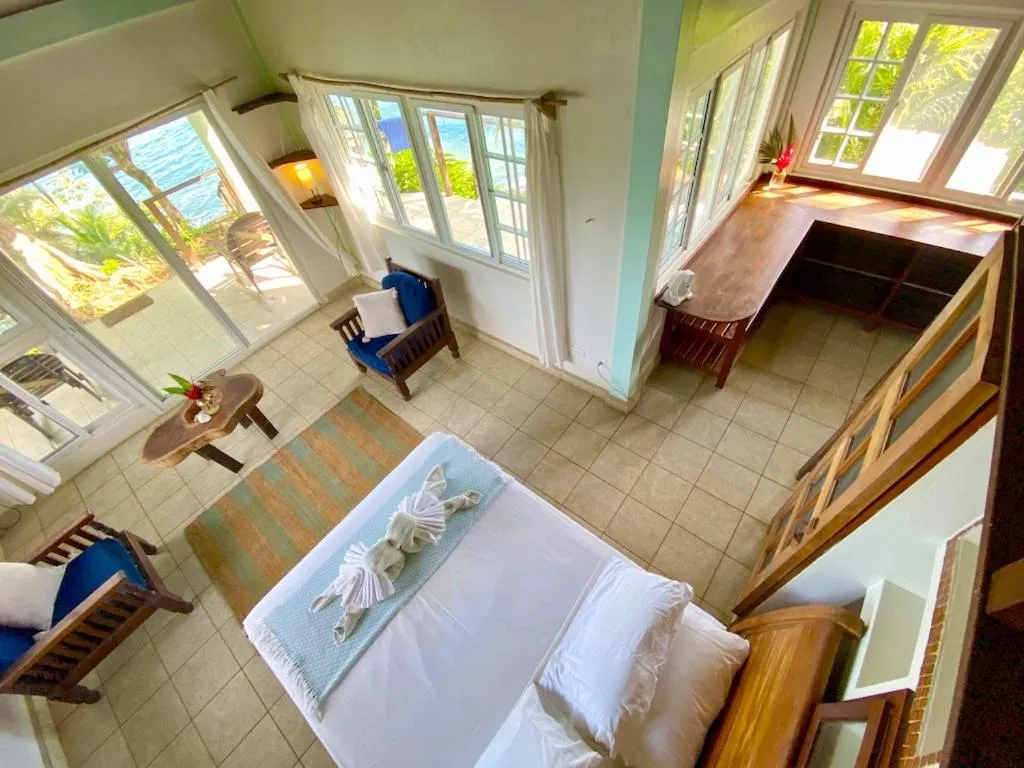 Bed in Bird Island Bungalows
